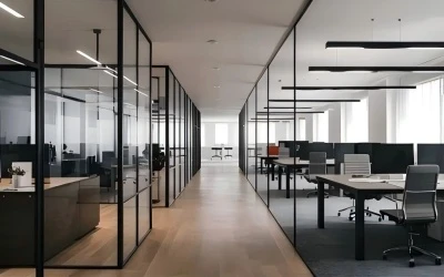 Indoor LED suspended linear light illuminating contemporary office space, offering long-lasting performance with 5-year warranty.